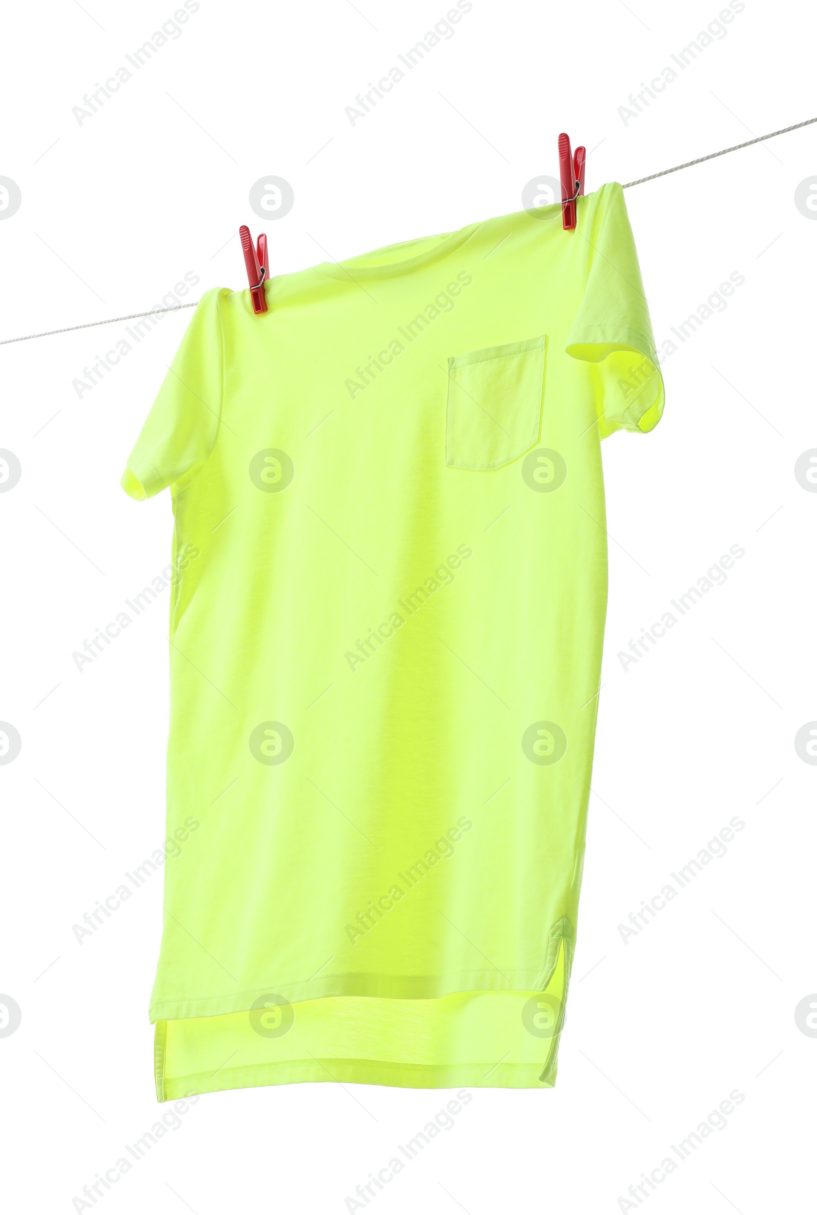 Photo of One green t-shirt drying on washing line isolated on white