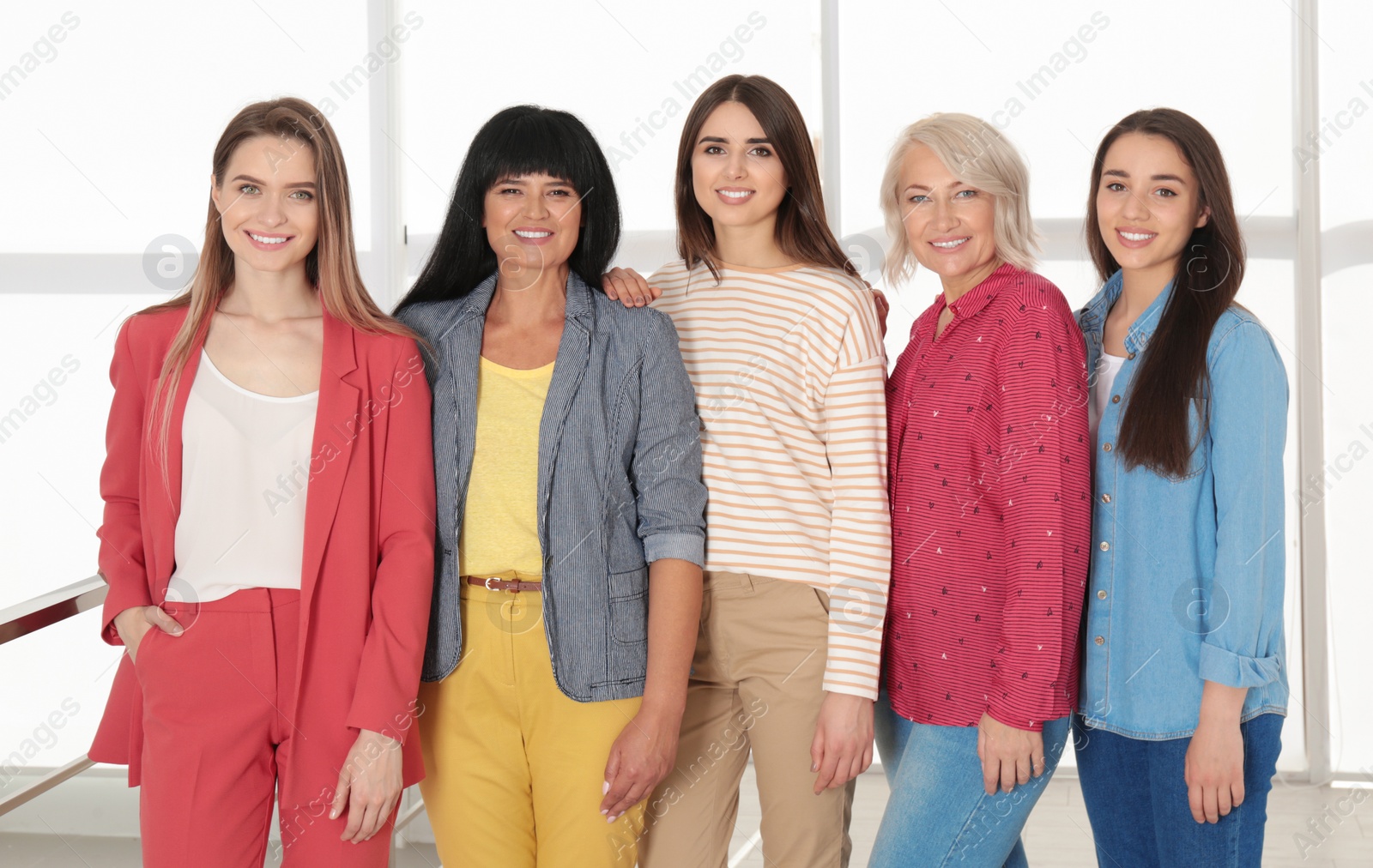 Photo of Group of ladies near window indoors. Women power concept