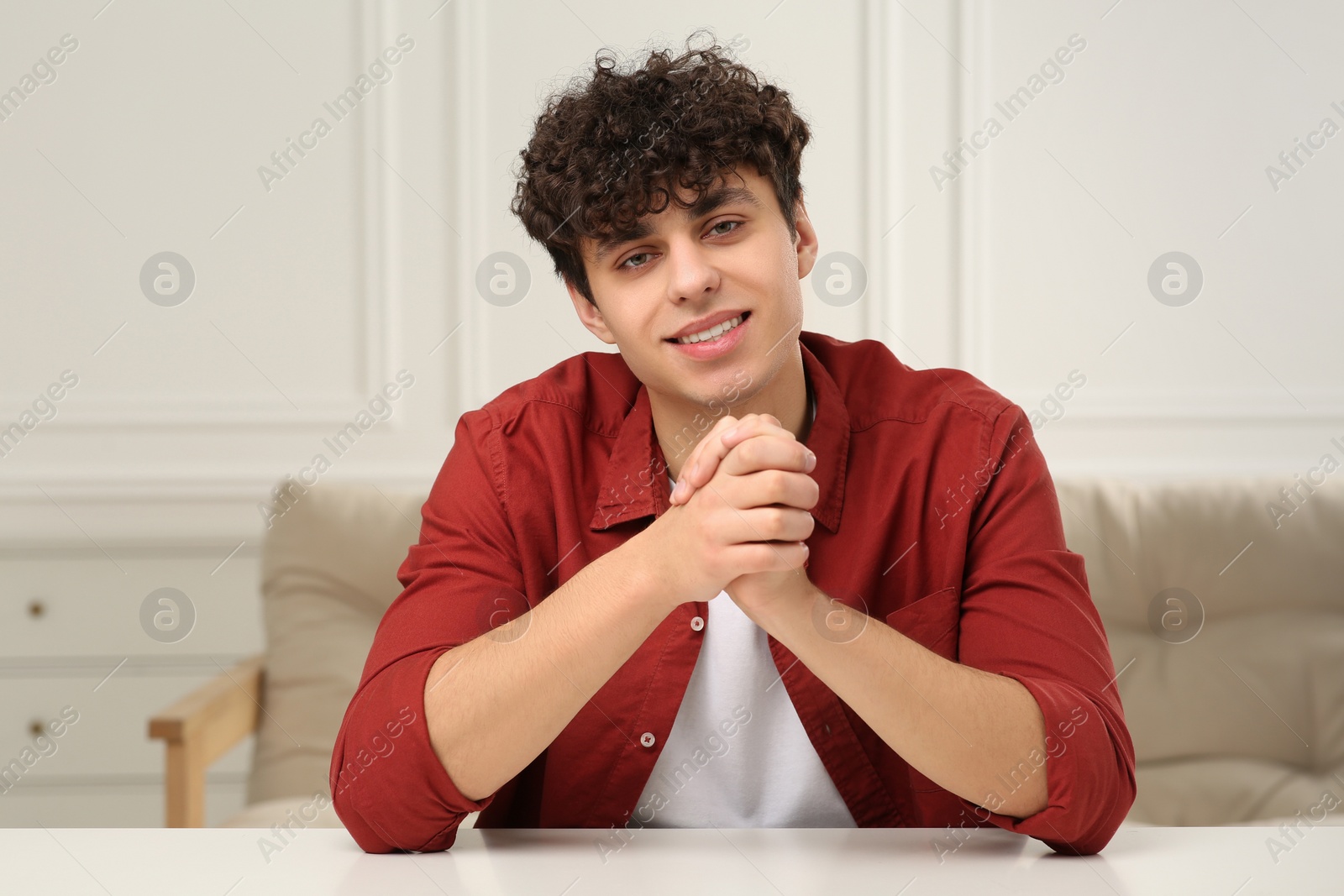 Photo of Young man having online video call at home, view from web camera