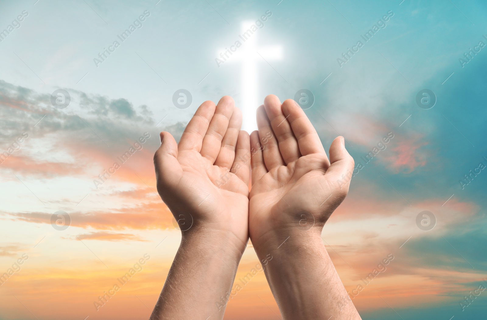 Image of Religion. Christian man praying against sky with glowing cross, closeup