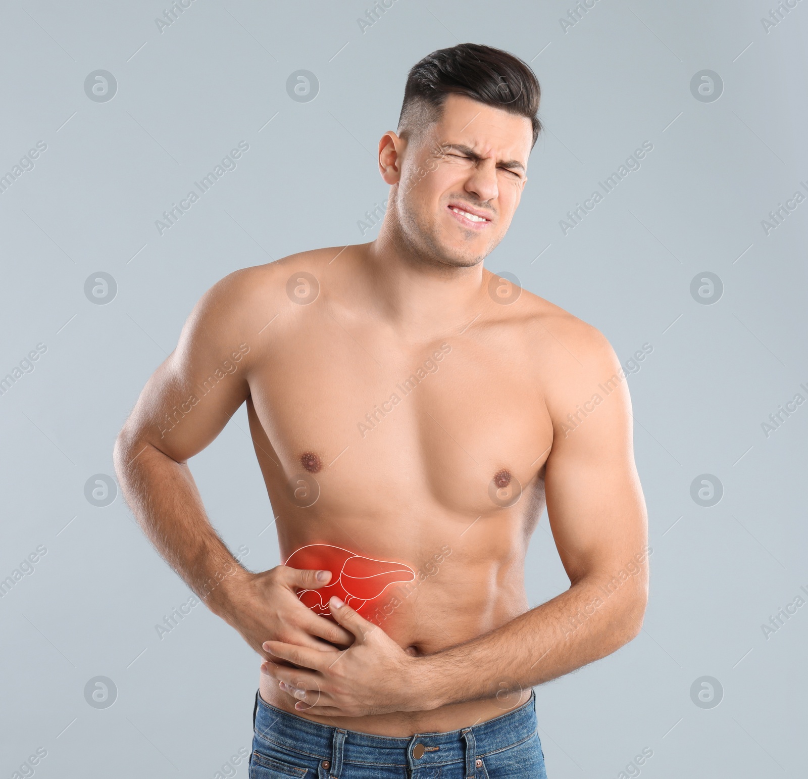 Image of Man suffering from liver pain on grey background