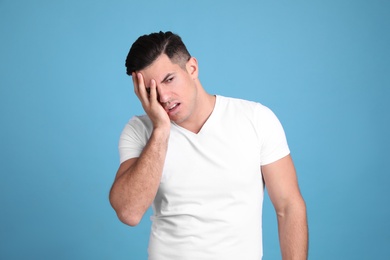 Photo of Portrait of stressed man on light blue background