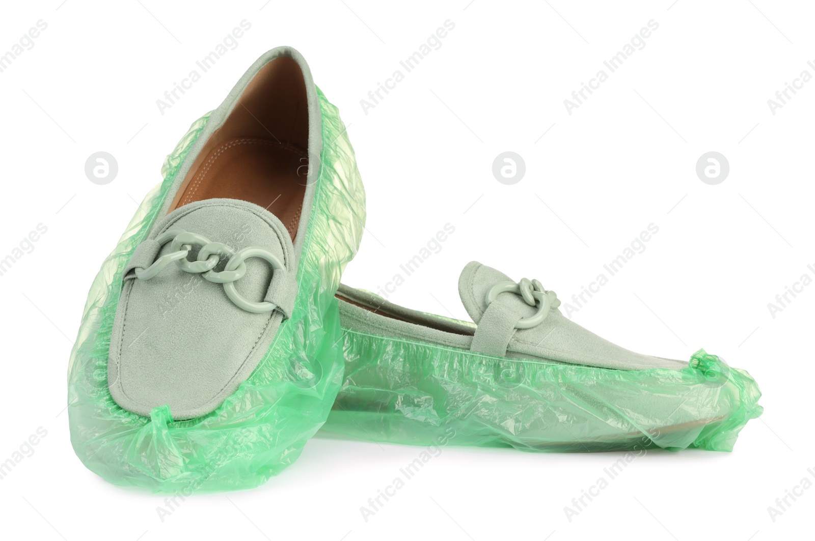 Photo of Women's mules in green shoe covers isolated on white