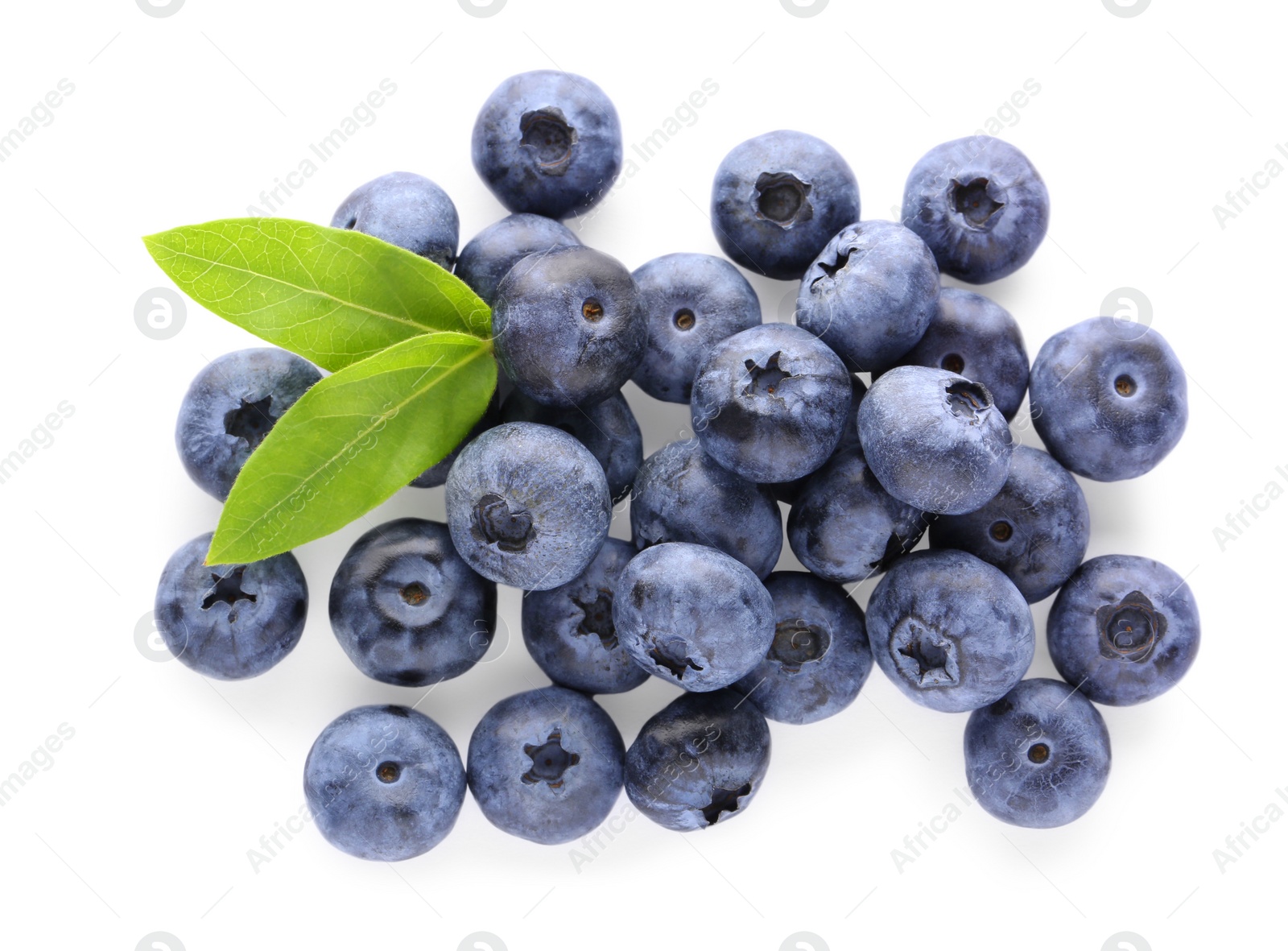 Photo of Pile of tasty fresh blueberries and green leaves on white background, top view
