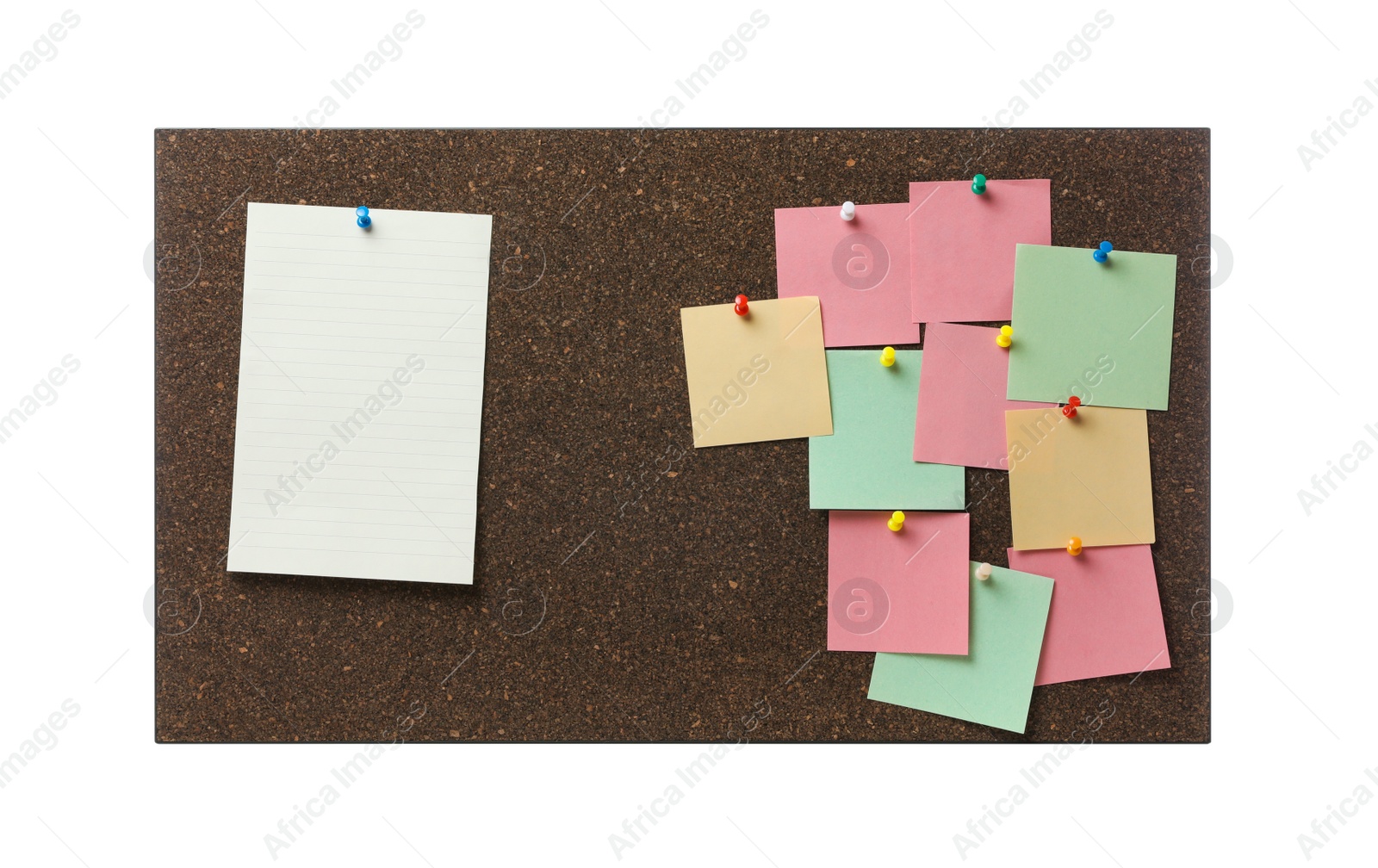 Photo of Empty notes pinned to cork board on white background