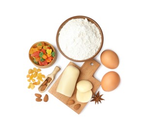 Photo of Marzipan and other ingredients for homemade Stollen on white background, top view. Baking traditional German Christmas bread