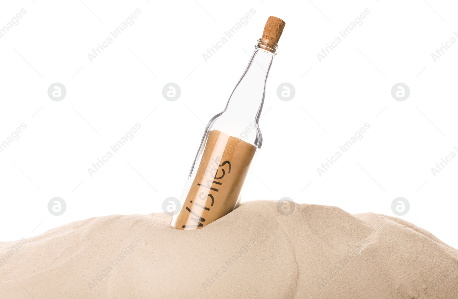 Photo of Corked glass bottle with Wishes note in sand on white background