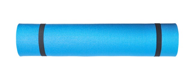 Photo of Blue rolled camping or exercise mat on white background, top view