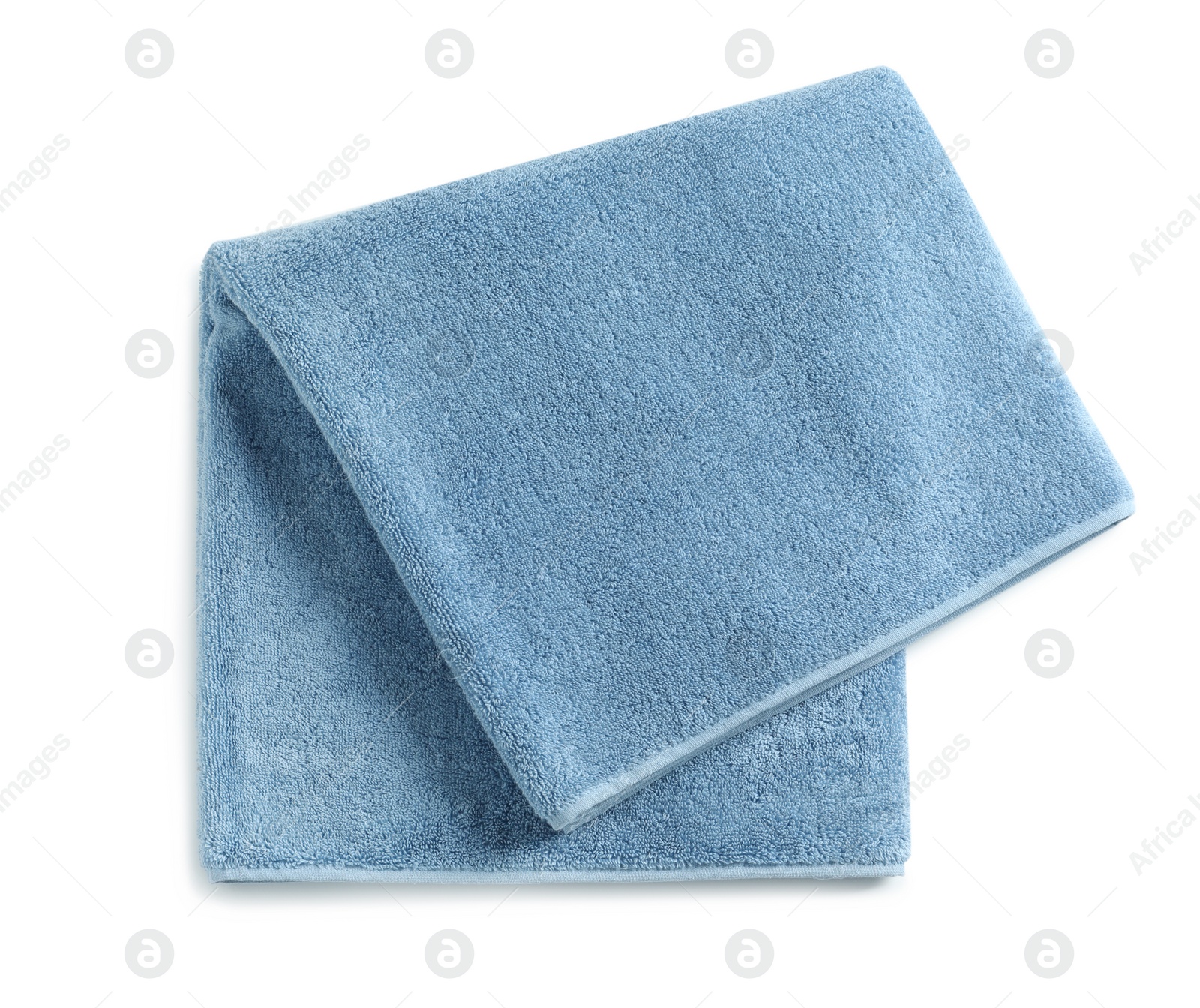 Photo of Soft folded towel isolated on white, top view