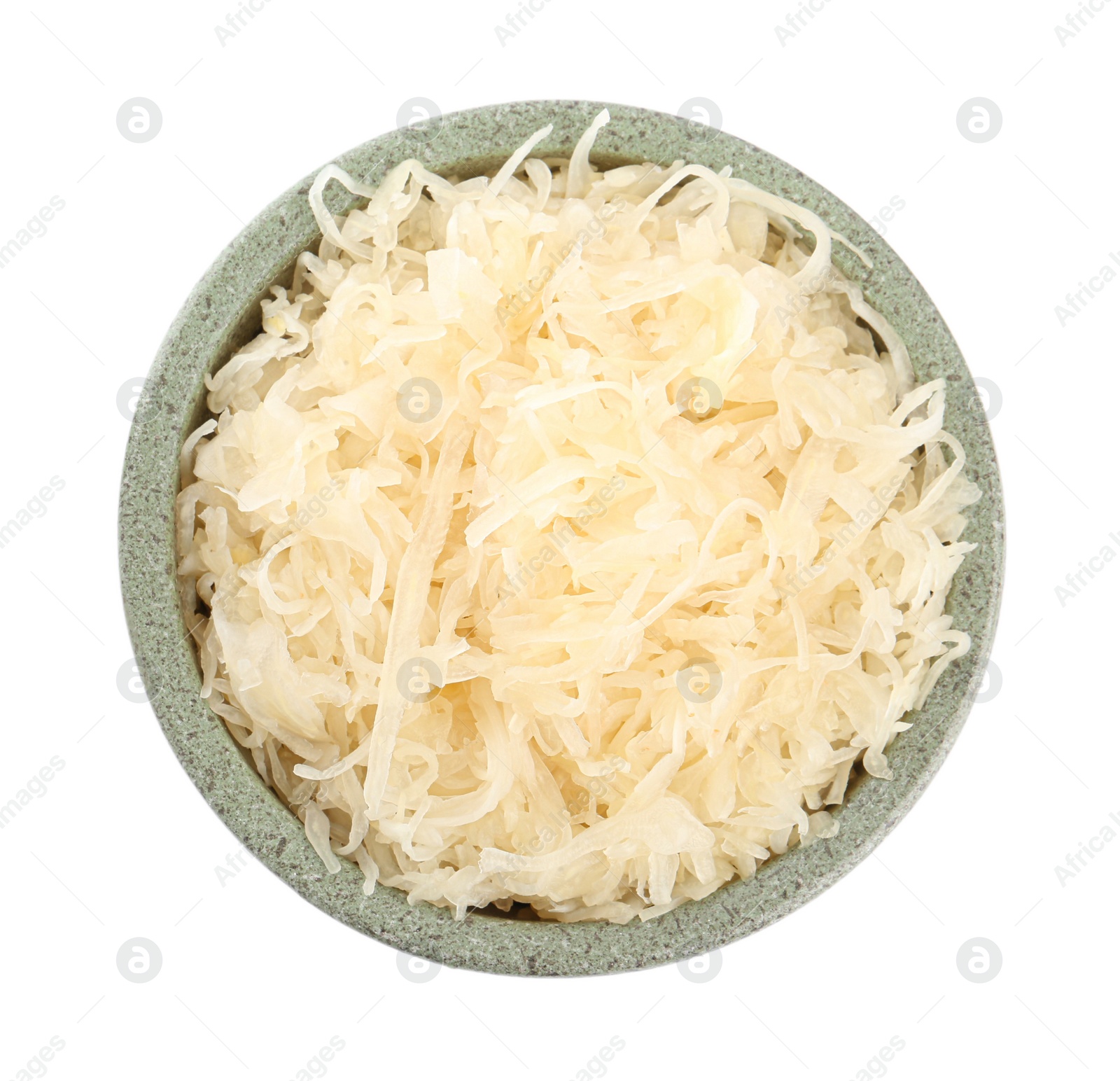 Photo of Bowl of tasty fermented cabbage isolated on white, top view