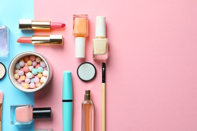 Flat lay composition with decorative cosmetics on color background