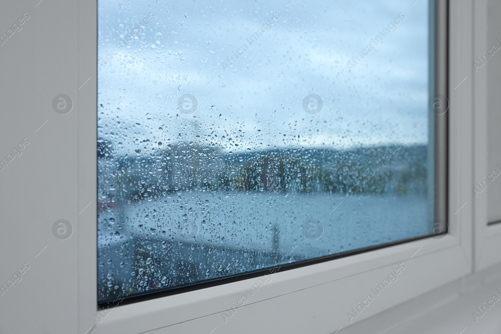 Photo of New window with beautiful clear rain drops, closeup