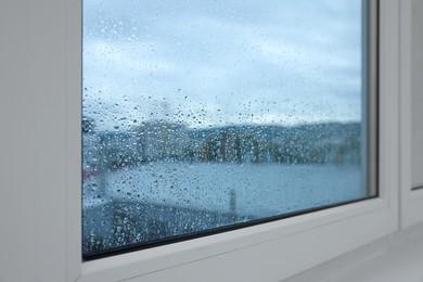 New window with beautiful clear rain drops, closeup