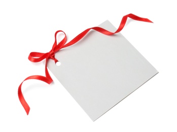 Photo of Blank gift tag with satin ribbon on white background