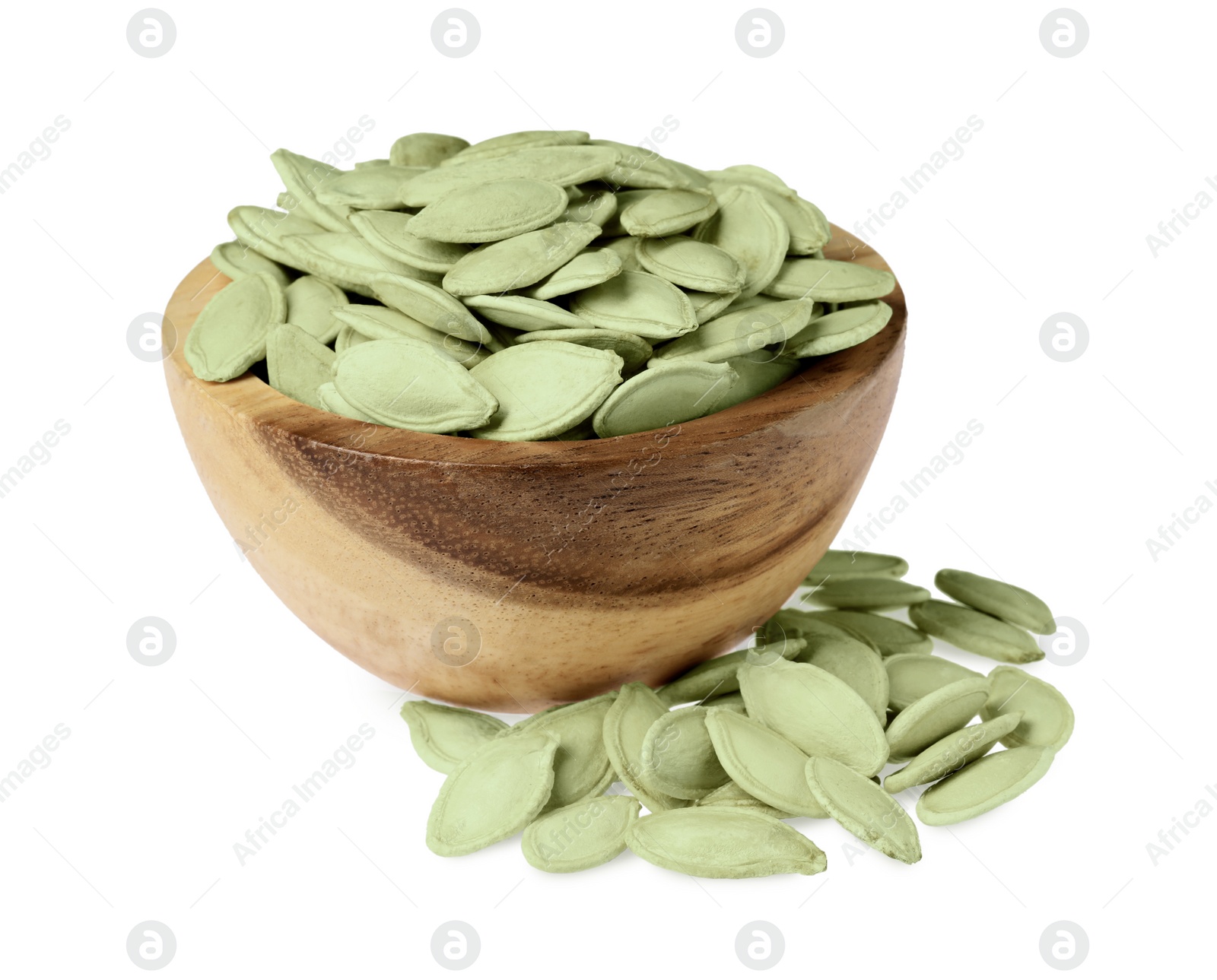 Photo of Wooden bowl with pumpkin seeds isolated on white