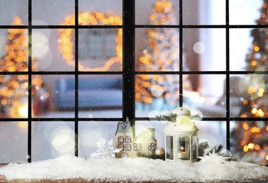 Beautiful composition with Christmas lantern near window