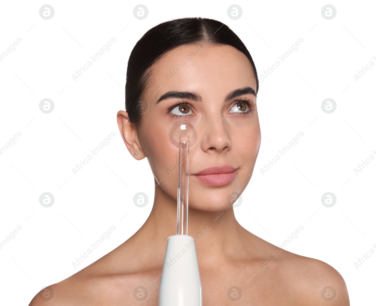 Photo of Woman using high frequency darsonval device on white background