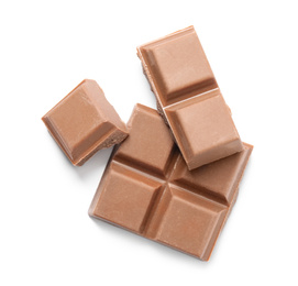 Photo of Pieces of delicious milk chocolate isolated on white, top view