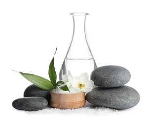 Composition with spa stones and sea salt on white background