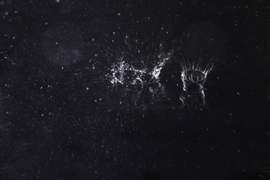 Photo of Splash of water on dark background. Rainy weather