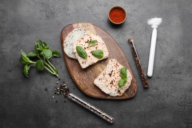 Photo of Flat lay composition with sandwiches, various spices and test tubes on grey background