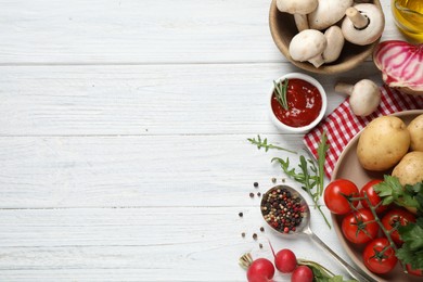 Flat lay composition with fresh products on white wooden table, space for text. Healthy cooking