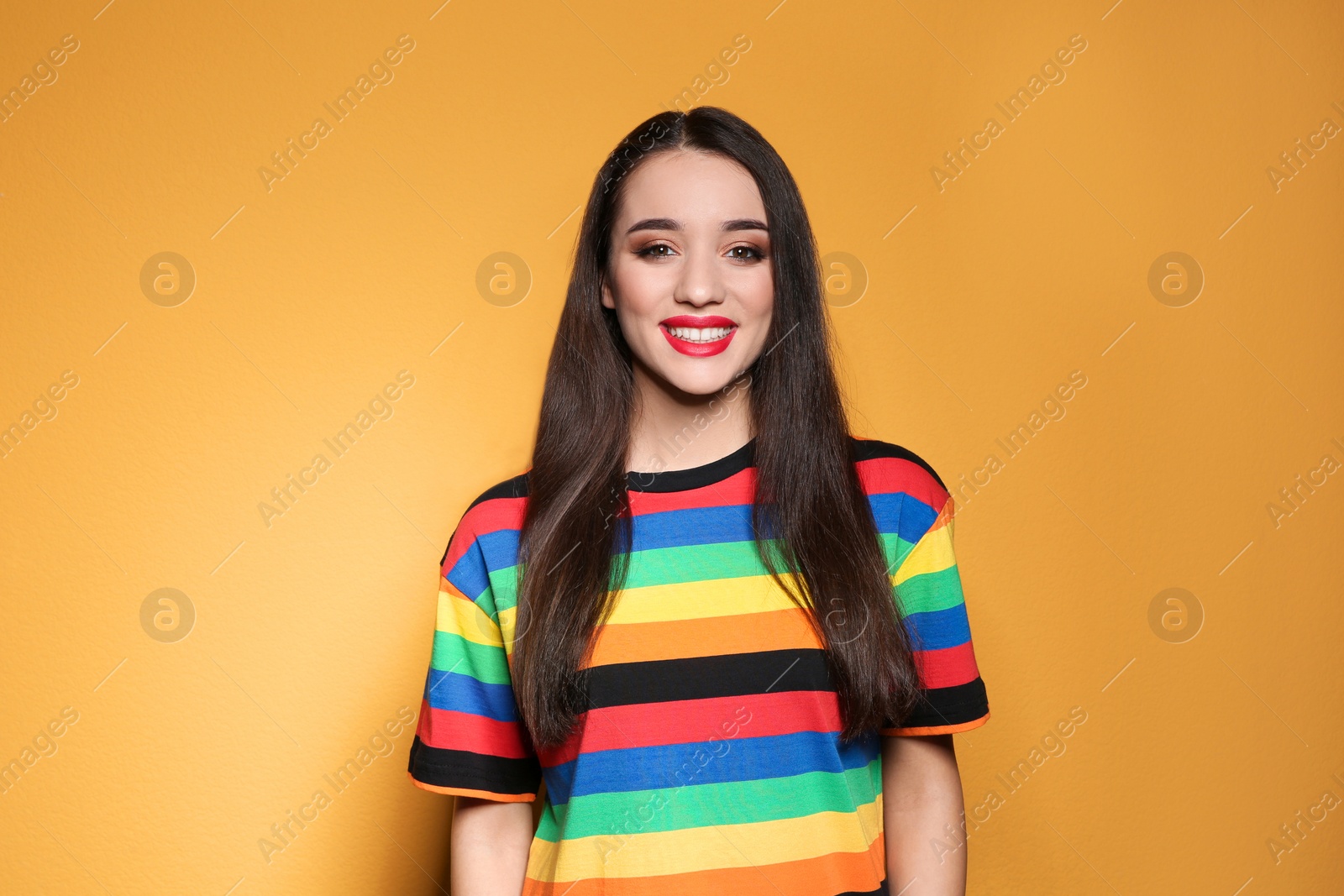 Photo of Portrait of beautiful young woman on colorful background