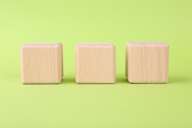Photo of International Organization for Standardization. Wooden cubes with abbreviation ISO on light green background
