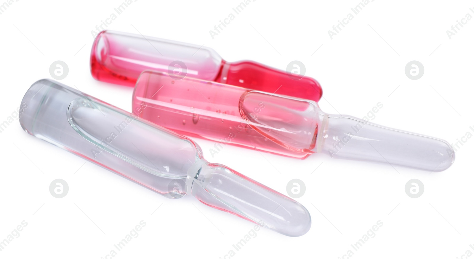Photo of Glass ampoules with pharmaceutical products on white background