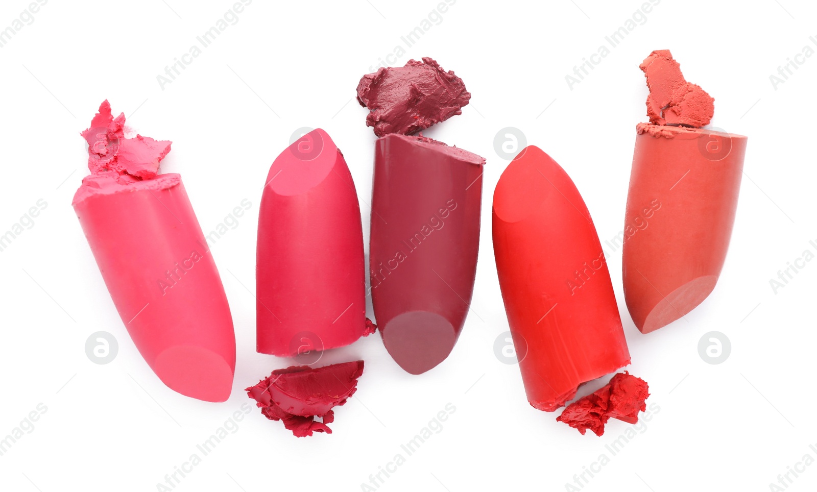 Photo of Different beautiful lipsticks on white background, top view