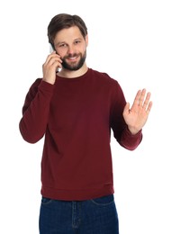 Man talking on smartphone against white background