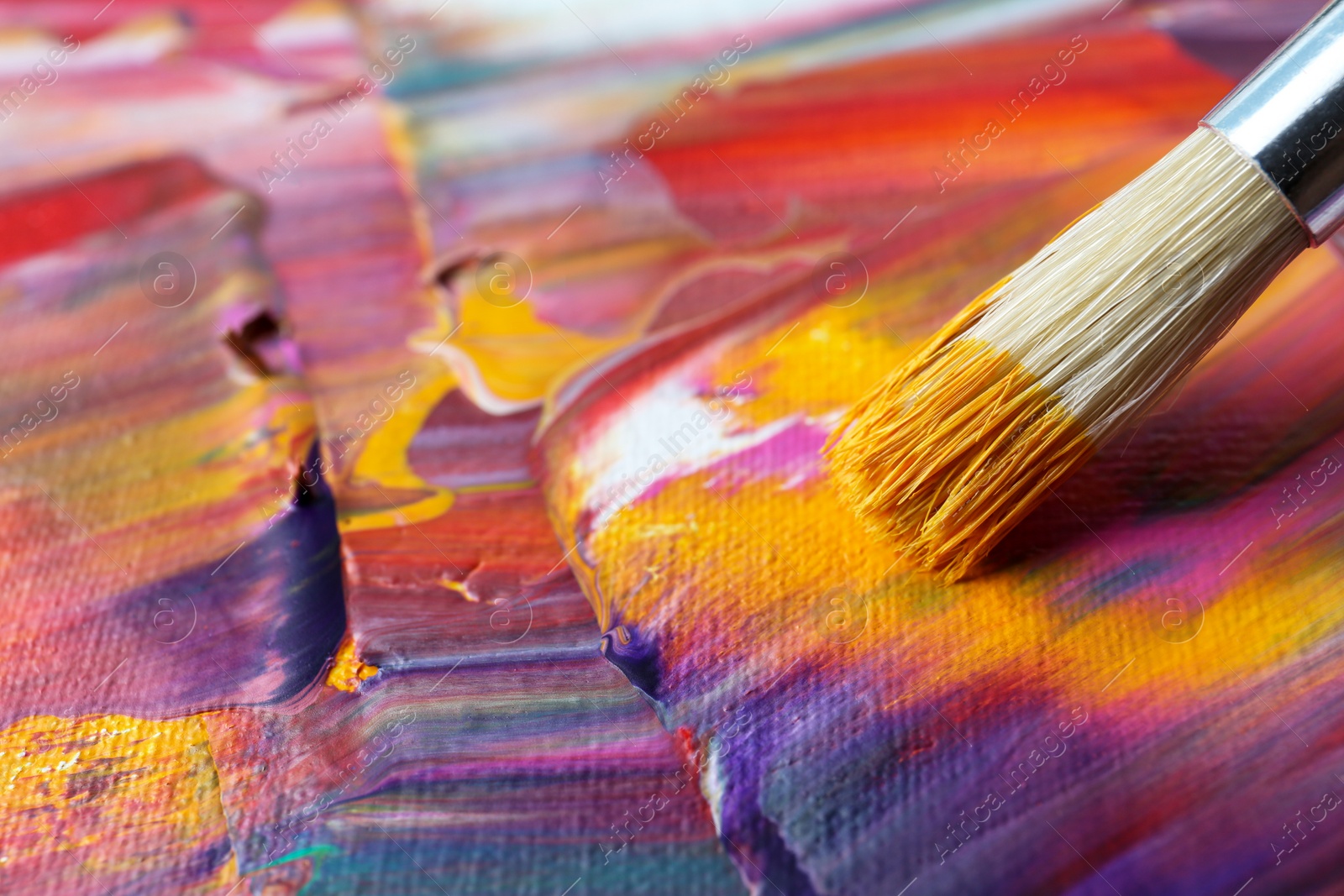 Photo of Abstract colorful paint and brush, closeup view