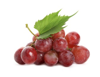 Photo of Cluster of ripe red grapes with green leaf on white background