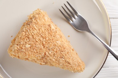 Photo of Piece of delicious Napoleon cake served on table, top view