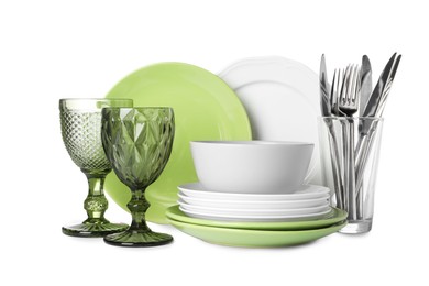 Photo of Set of beautiful ceramic dishware, glasses and cutlery isolated on white