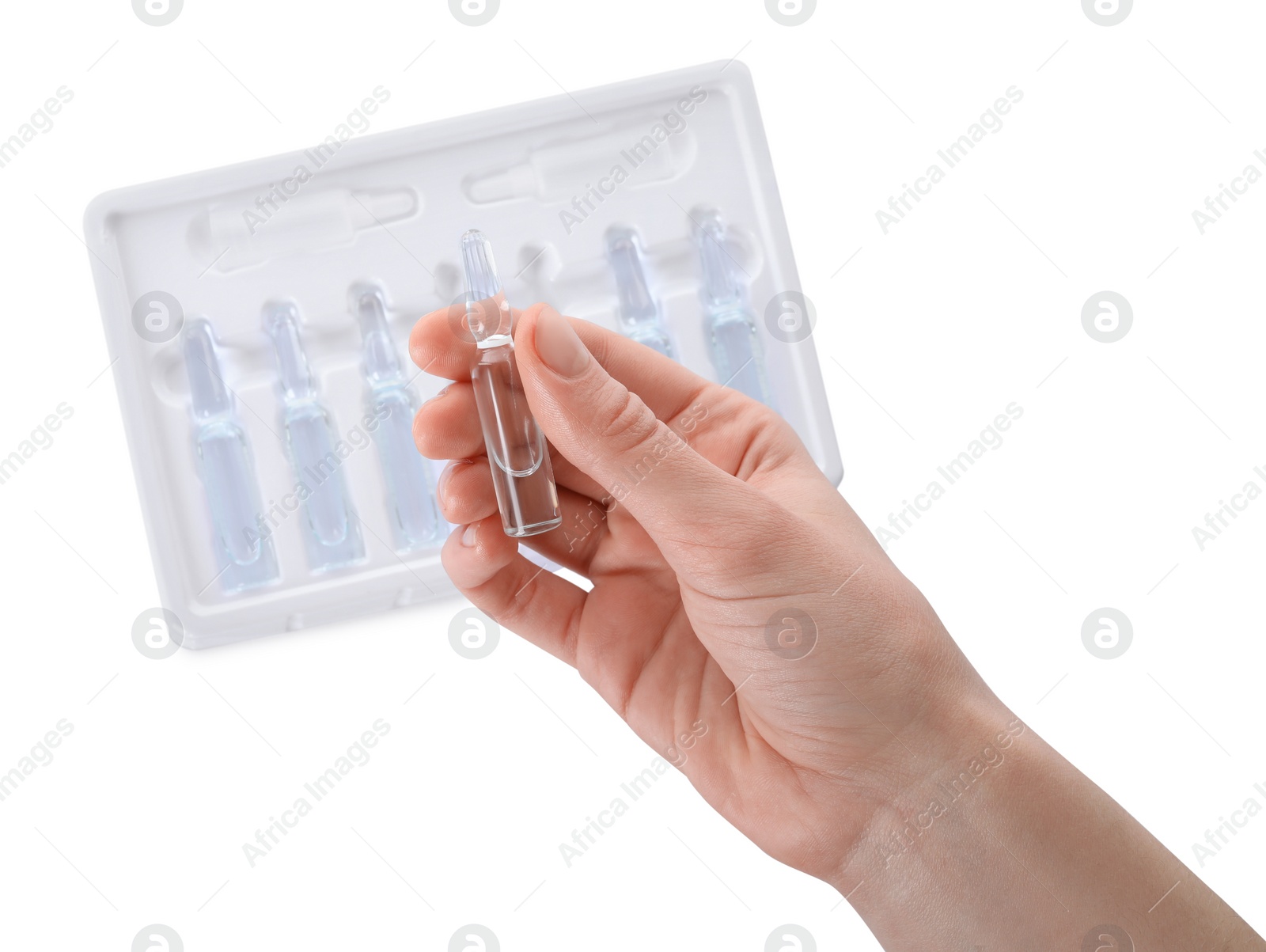 Photo of Woman holding glass ampoule with medication on white background, top view