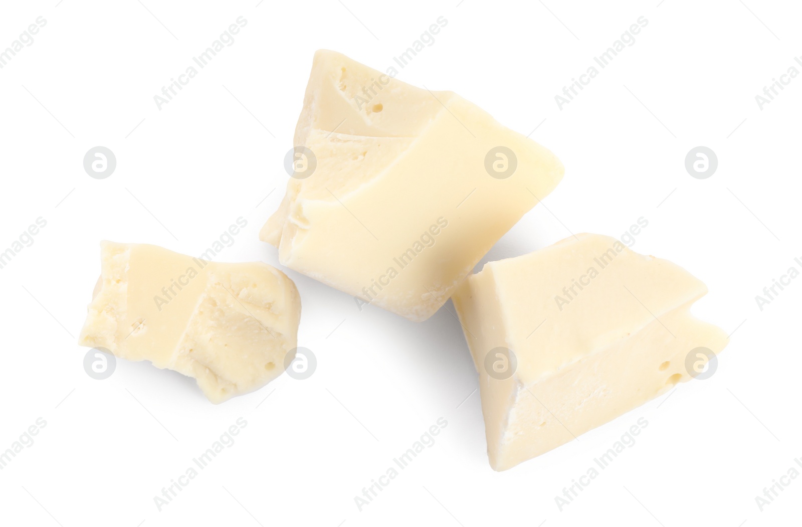 Photo of Pieces of tasty chocolate isolated on white, top view