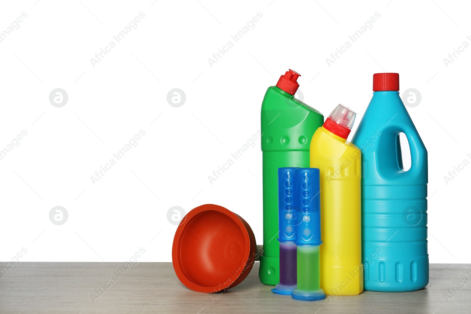 Photo of Composition with different toilet cleaning tools on wooden table against white background. Space for text