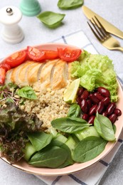 Photo of Healthy meal. Tasty vegetables, quinoa and chicken breast in bowl on white table, closeup