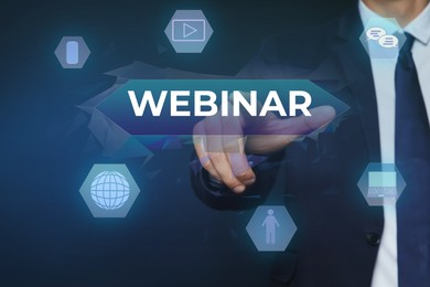 Image of Webinar concept. Closeup view of man near virtual screen with different icons on blue background