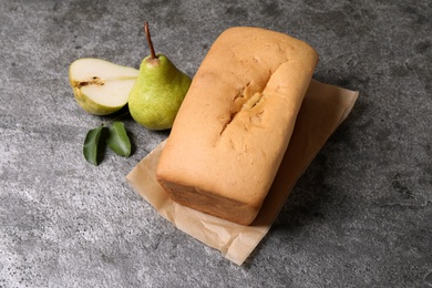 Tasty bread and pears on grey table. Homemade cake