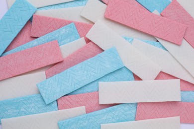 Sticks of tasty chewing gum as background, top view