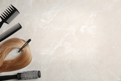 Photo of Flat lay composition with professional hairdresser tools on grey background