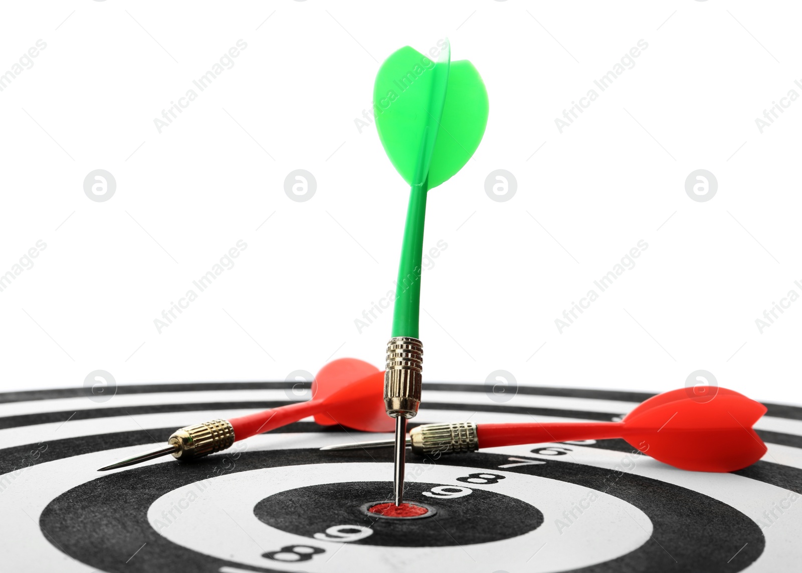 Photo of Arrow hitting target on dart board against white background