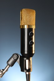 Stand with microphone on dark background, closeup. Sound recording and reinforcement
