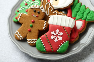 Tasty homemade Christmas cookies on light grey table, closeup