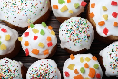 Traditional Easter cakes on wooden table, flat lay