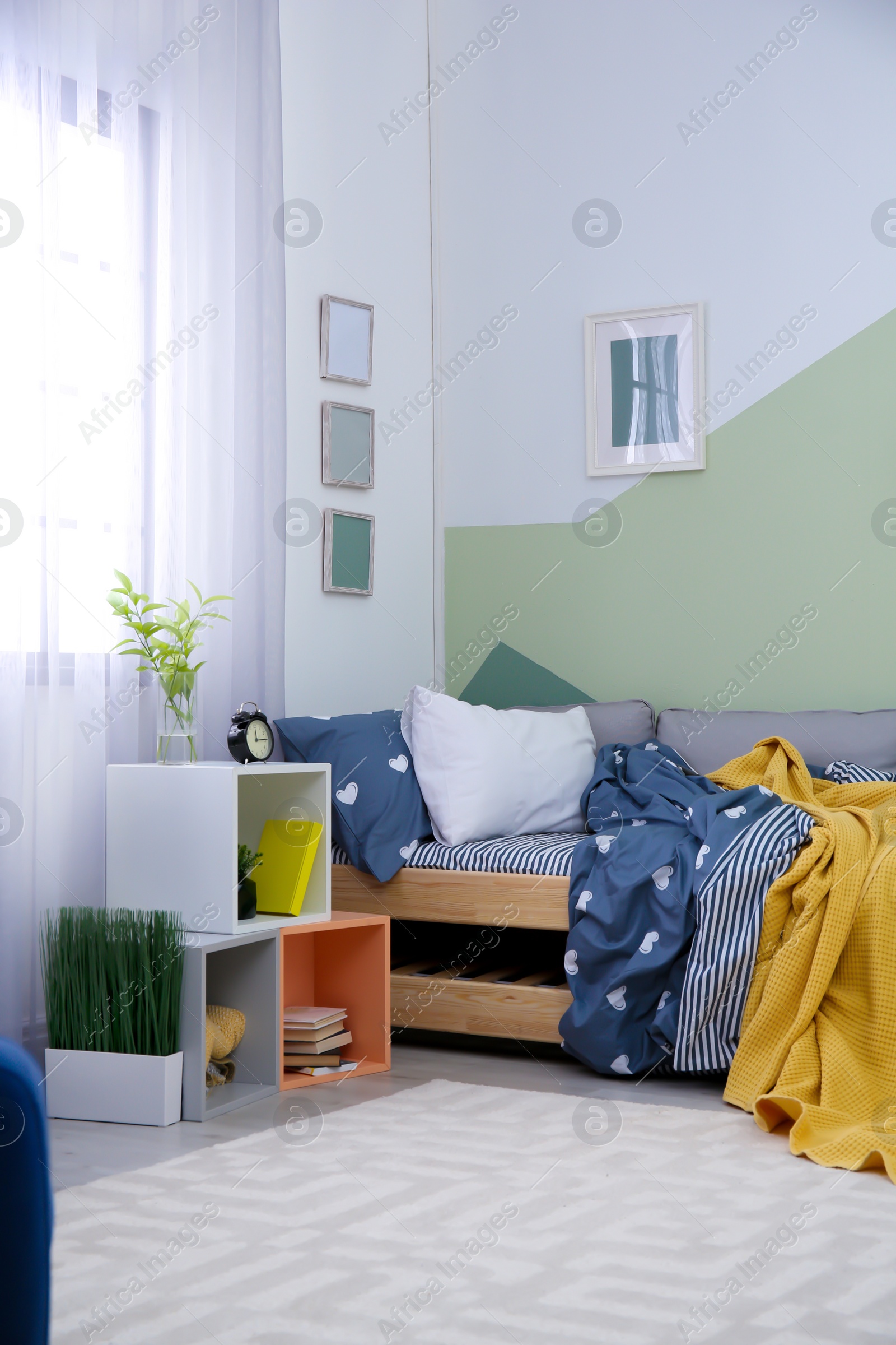 Photo of Modern child room interior with comfortable bed