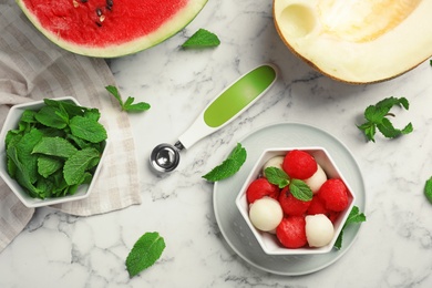 Photo of Flat lay composition with mint, melon and watermelon balls on marble background