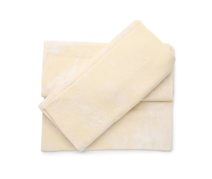 Photo of Raw puff pastry dough isolated on white, top view